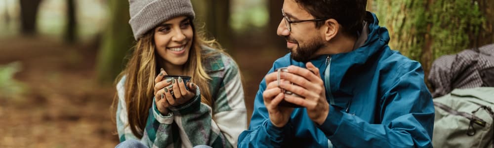 couple drinking yerba mate tea while hiking